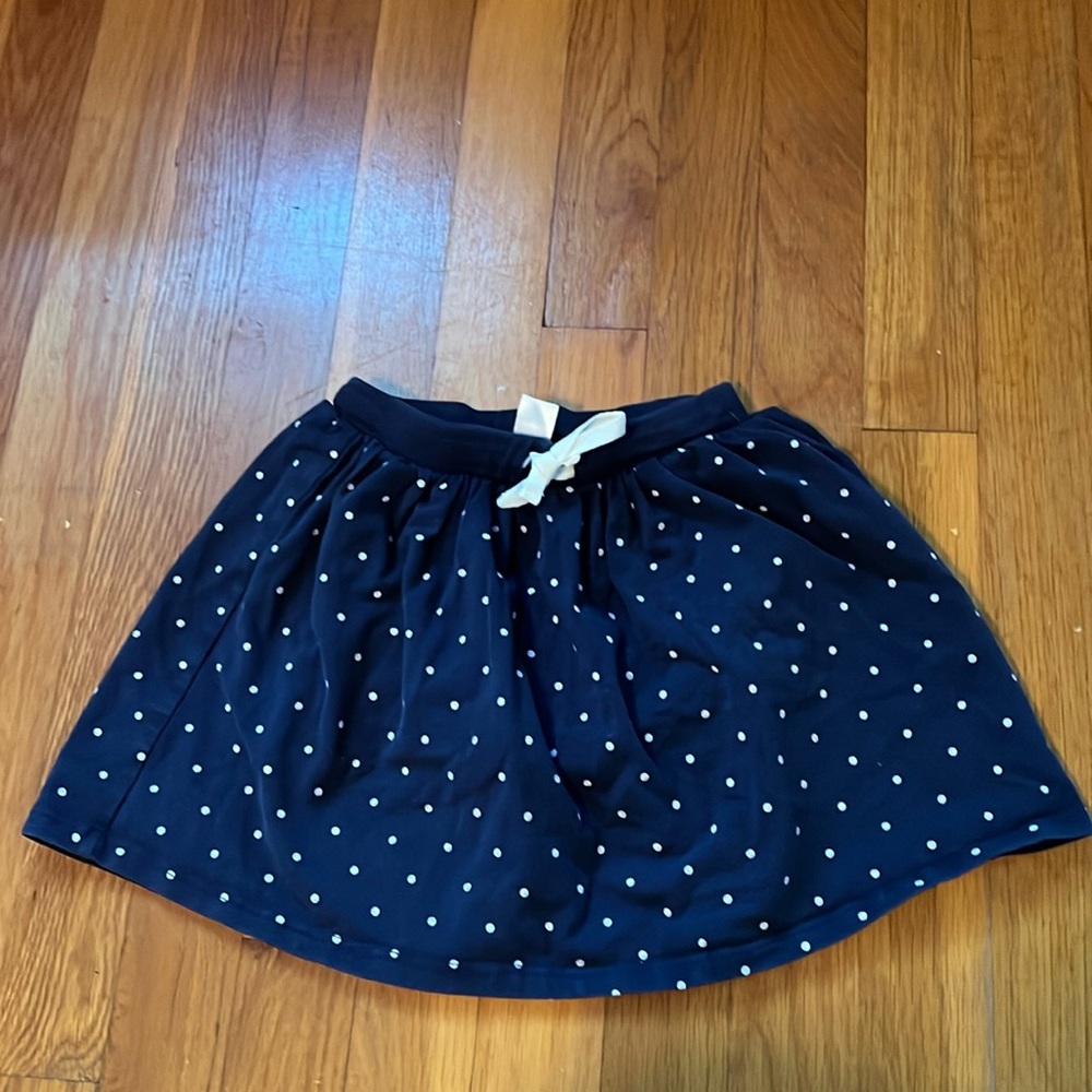 Carters, girls skort. Size 5. Blue with white polka dots.